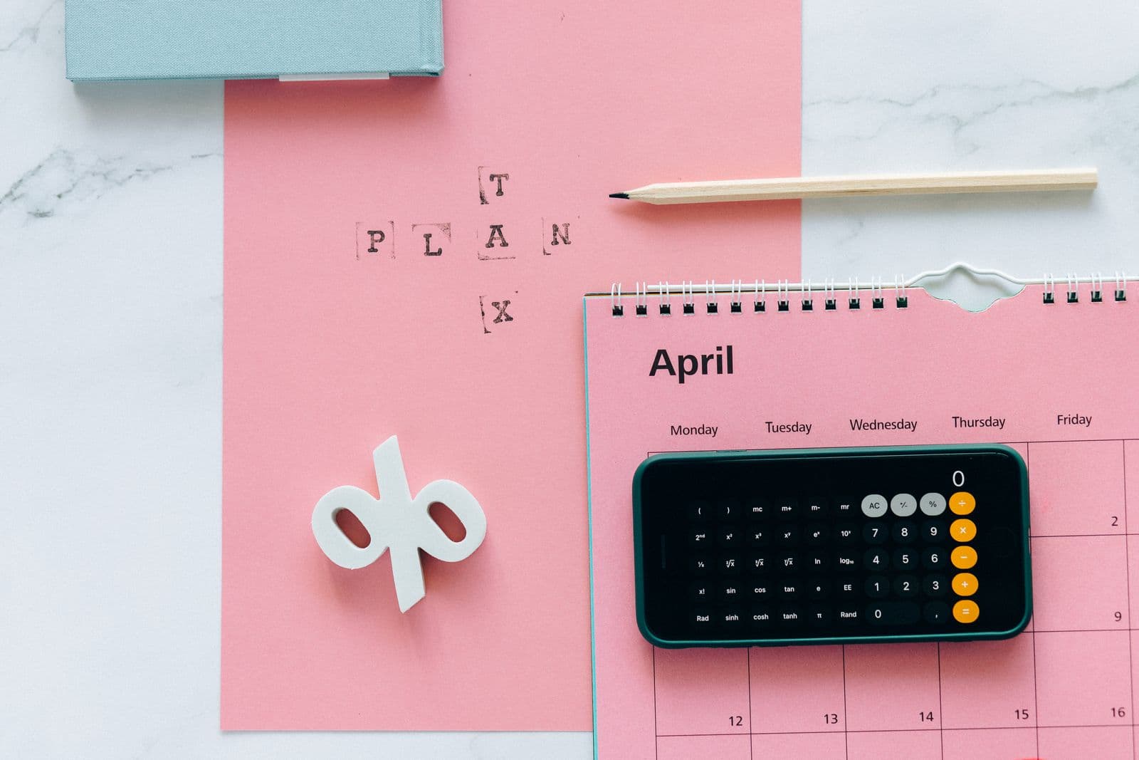 Calculator and paperwork used to analyze property value