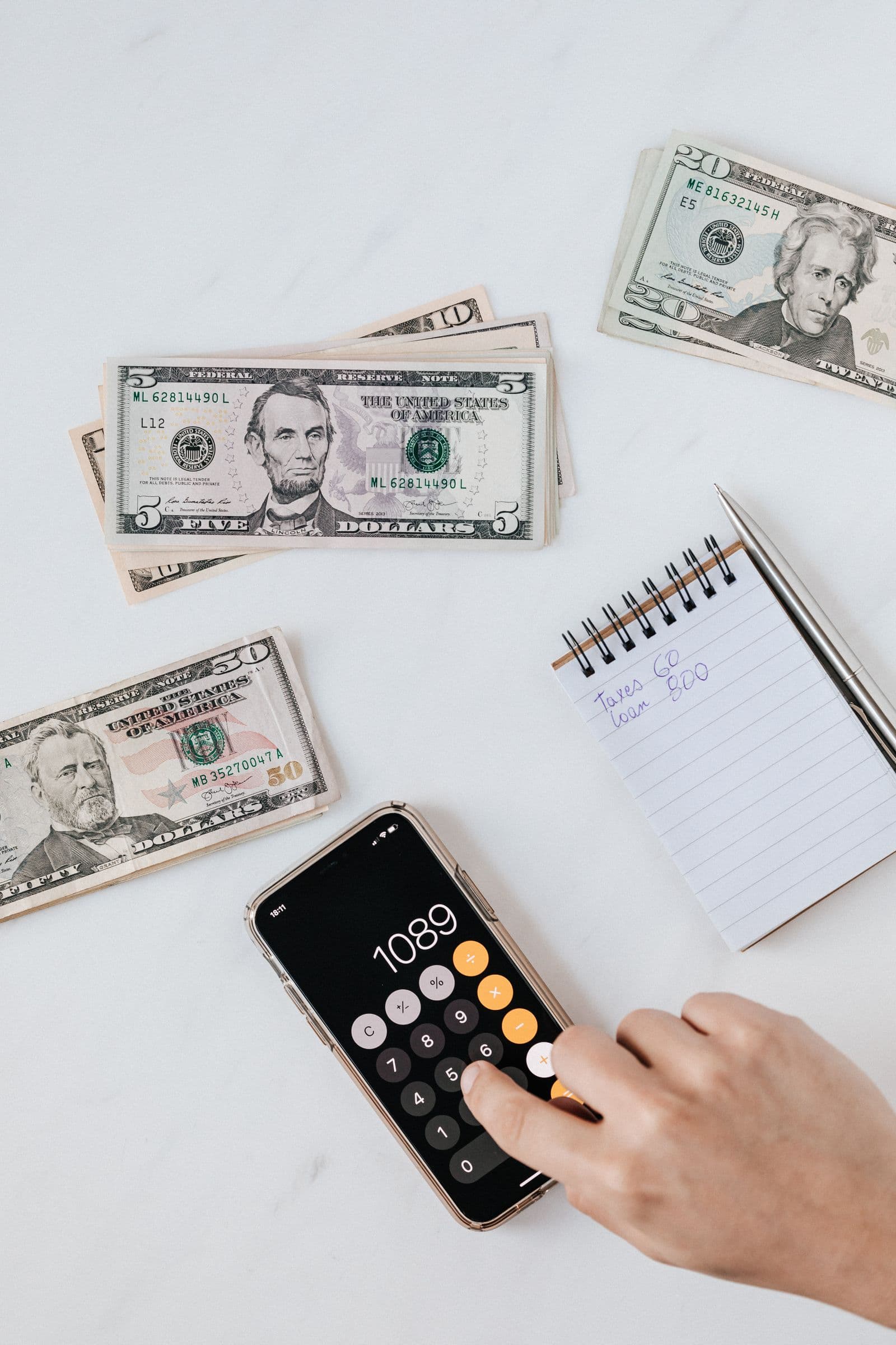 Calculator and financial documents during mortgage pre-approval review